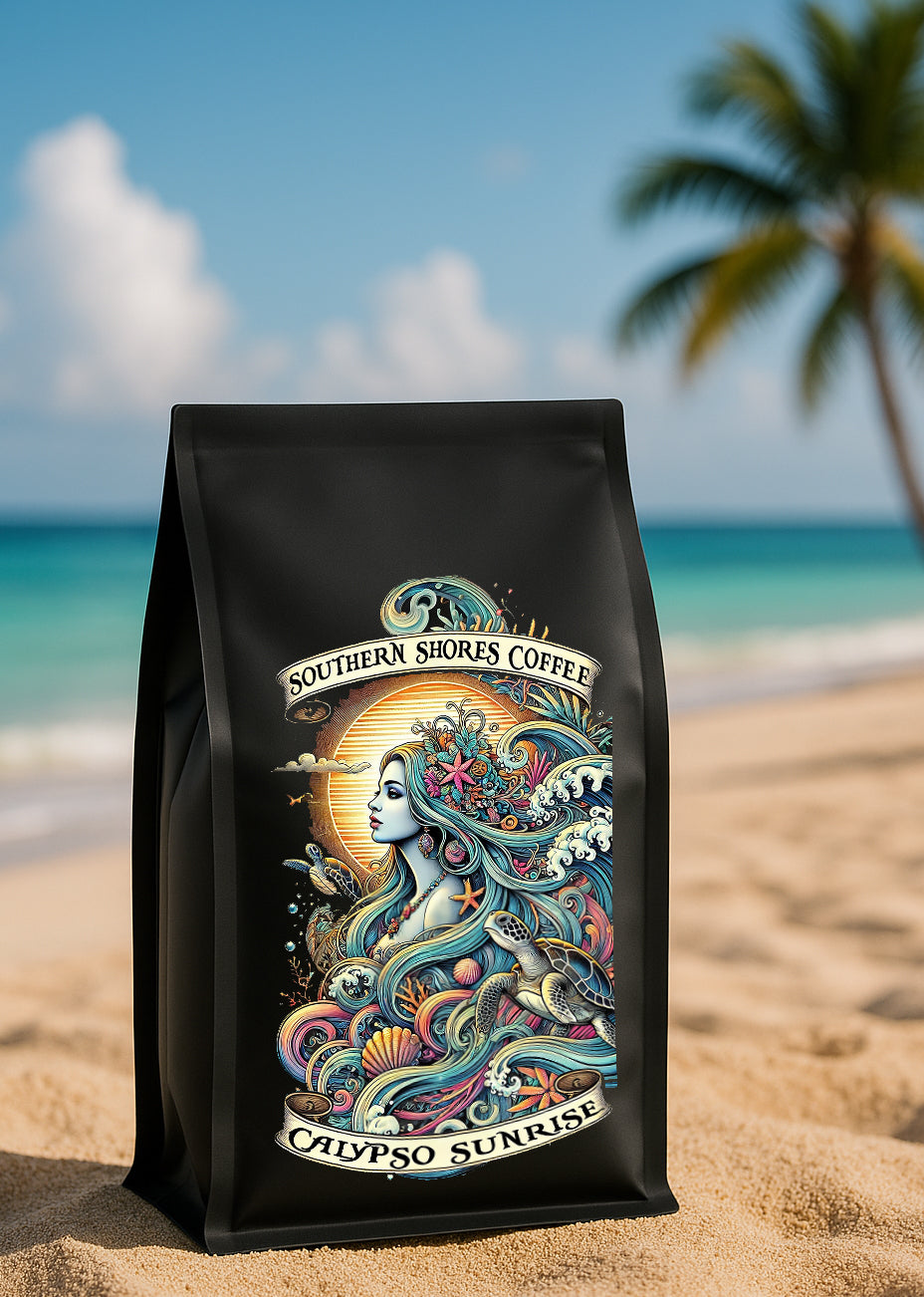 A bag of Calypso Sunrise coffee sitting on a tropical beach.
